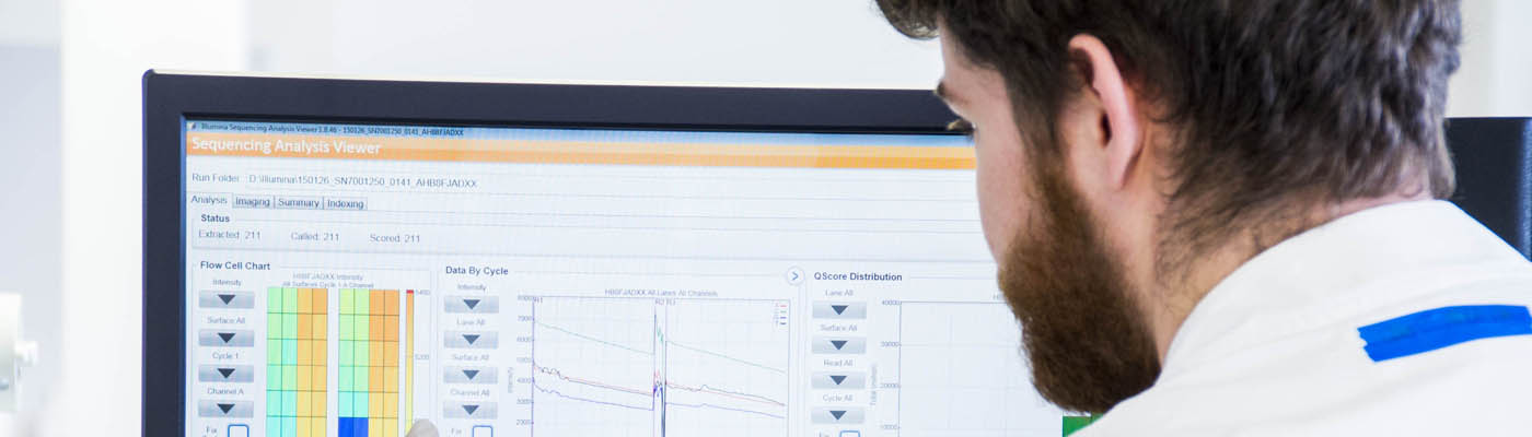 Image: Researcher in lab looking at a screen